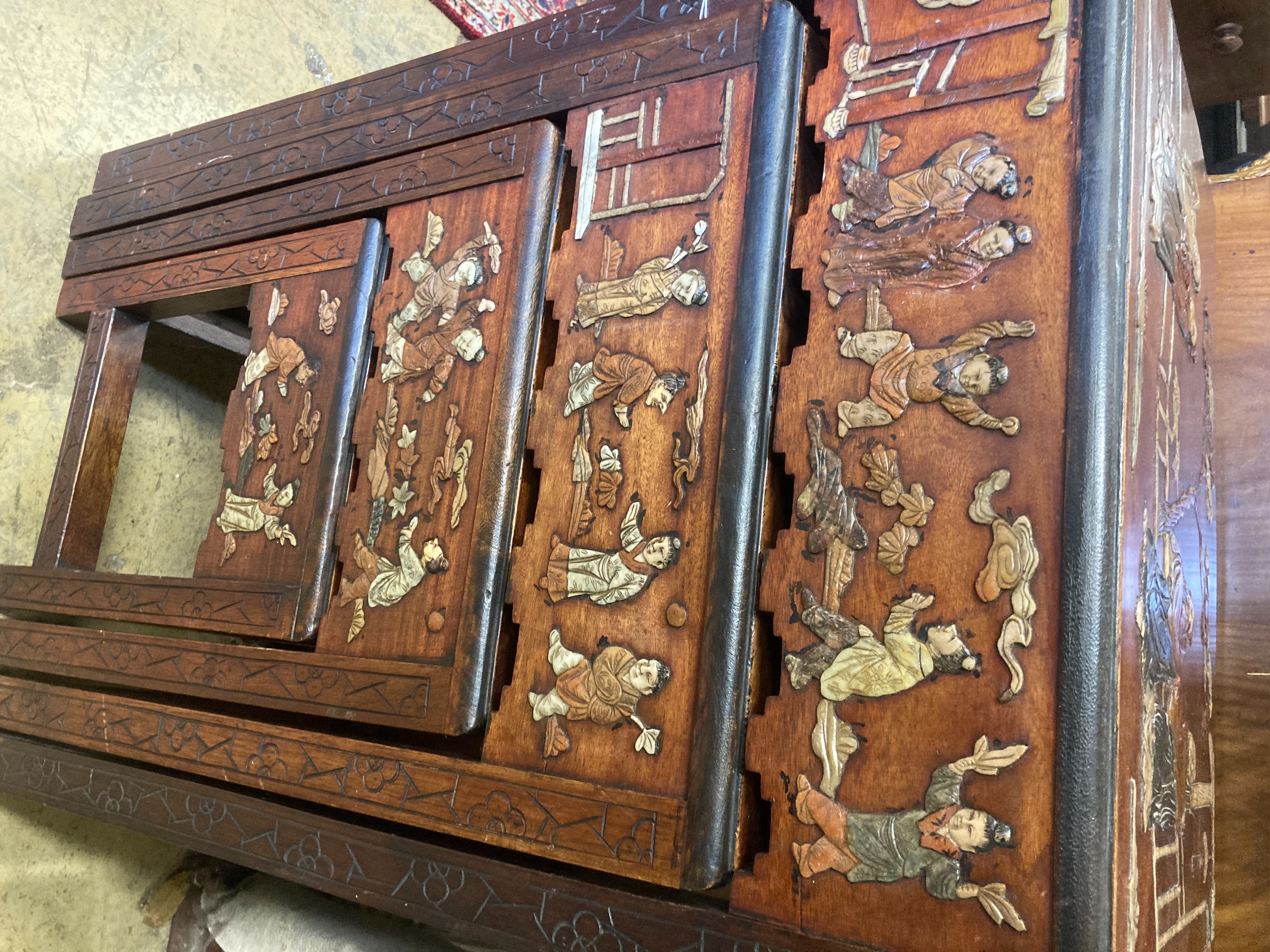 A 1920's Chinese quartetto nest of tables decorated with faux hardstone, width 46cm, depth 34cm, height 72cm